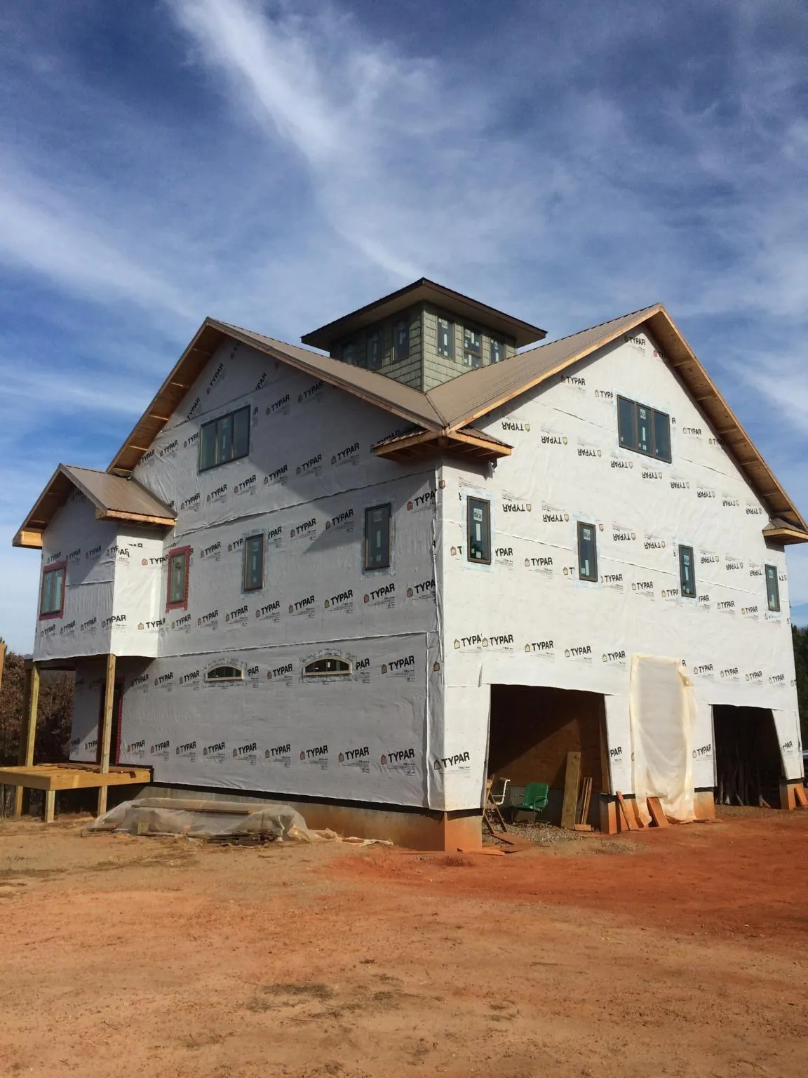 New two story house under construction with a cupola and gabled roofs in Little Mountain